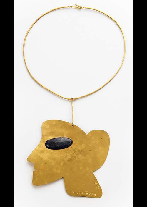 Man Ray ‘La Jolie, 1970’ pendant in 24 carat gold with lapis. Courtesy of the Louisa Guinness Gallery