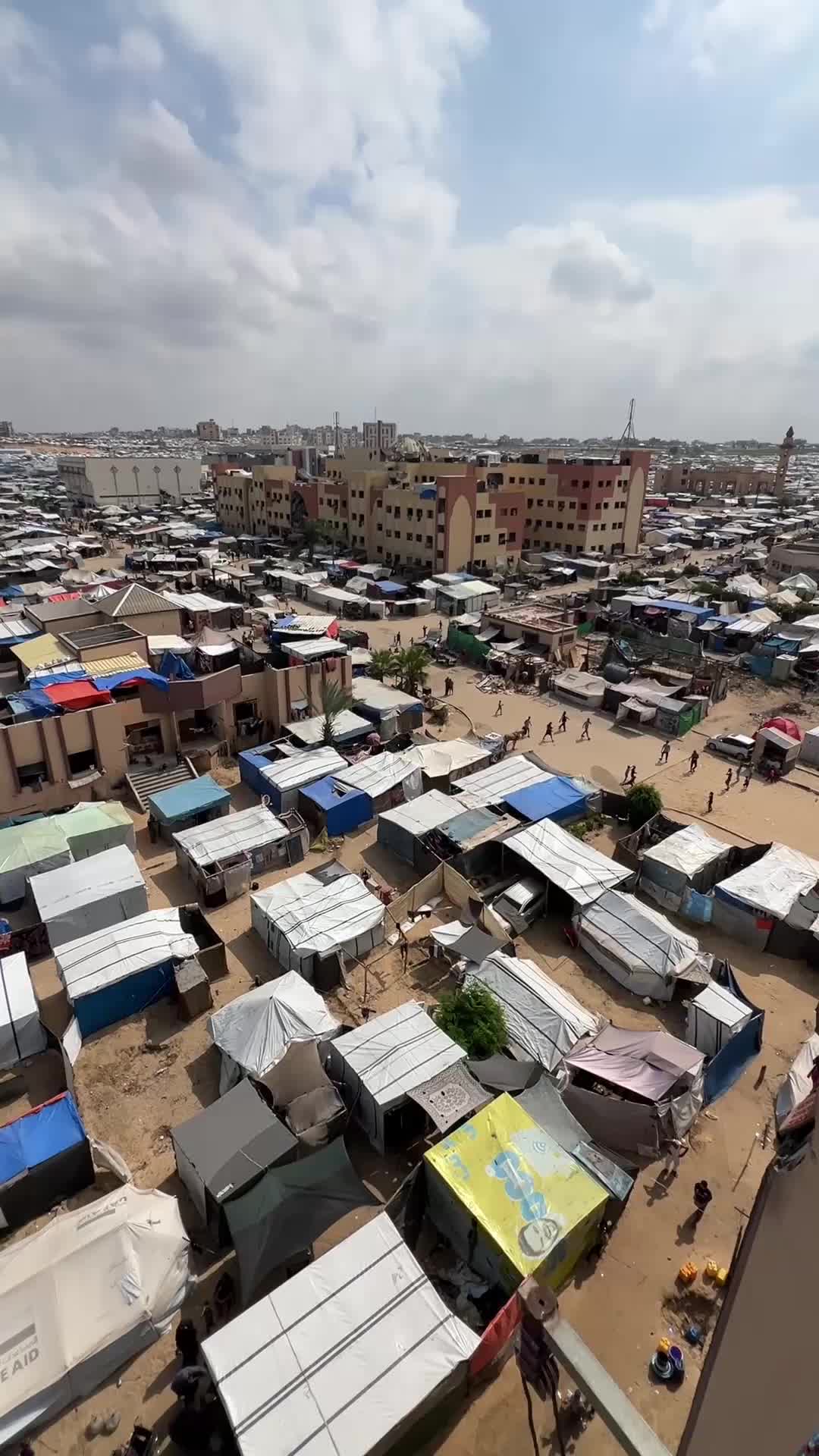 Video footage shows tent in a large camp