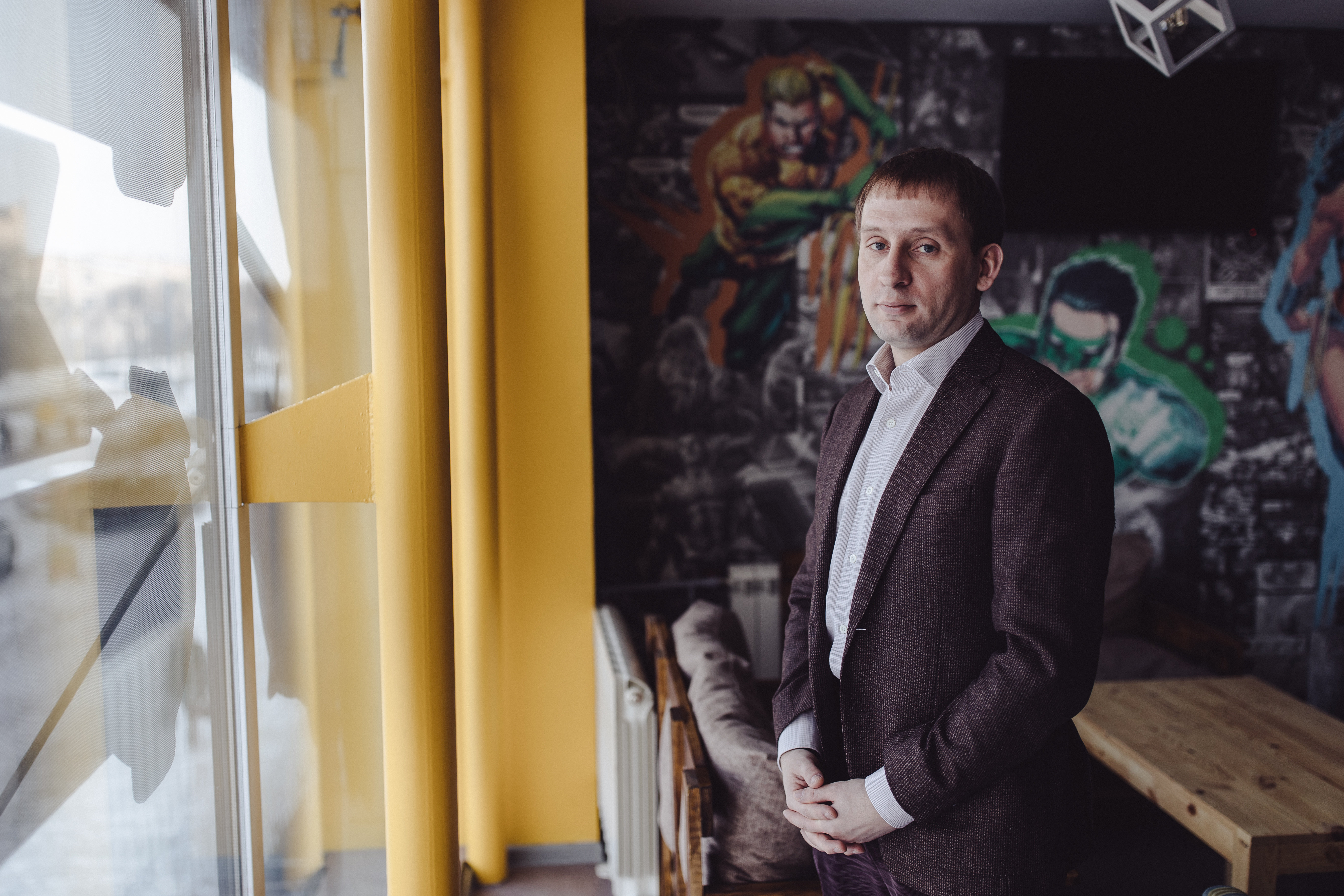 Governor Aleksander Kozlov posing in his office