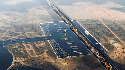 A computer generated image of a mirrored structure cutting across arid land, with a rectangular marina crowded with cruise ships and yachts.