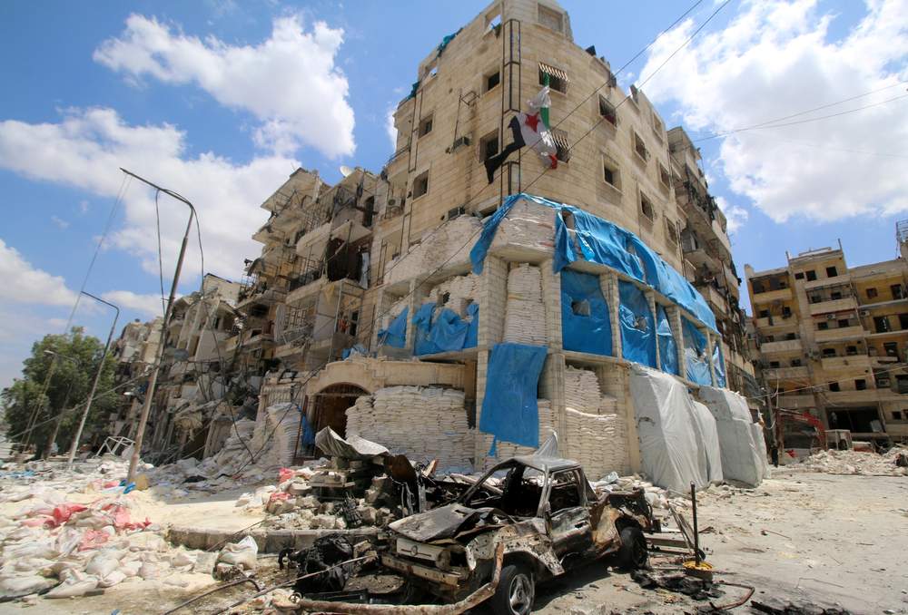 Burnt vehicles are pictured in front of the damaged Médecins Sans Frontières-backed hospital after it was hit by airstrikes in a rebel-held area of Aleppo Getty Images