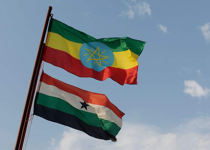 The flag of Ethiopia and, below it, Saudi Star's flag flying above the farm in Gambella