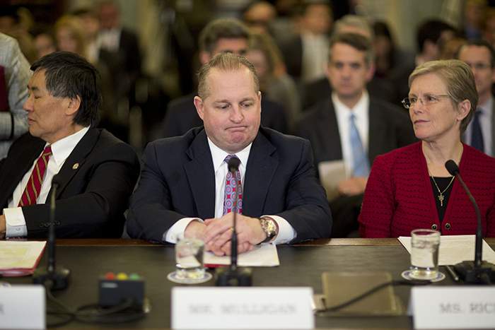 Target chief financial officer John Mulligan testifies before the US Senate Commerce Committee in March 2014