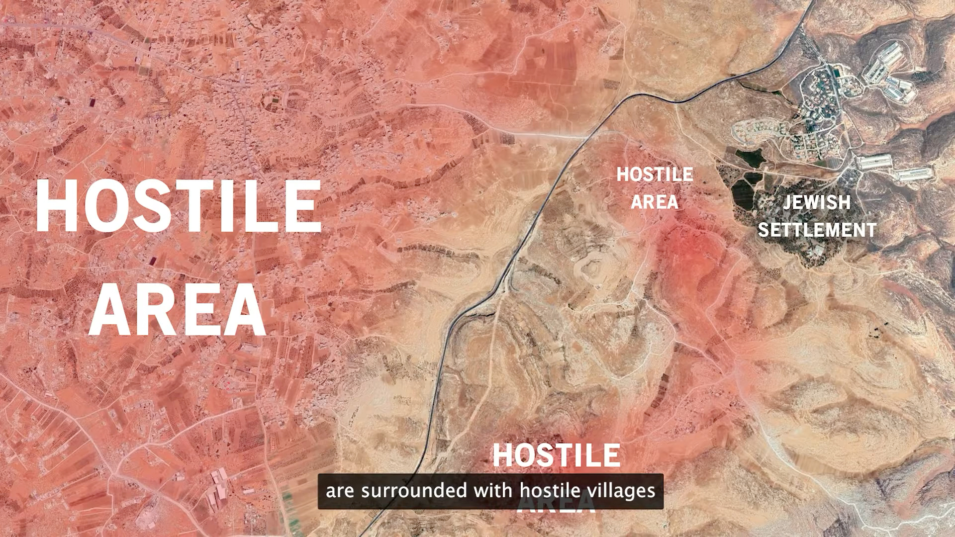 A still from a video showing a satellite image. A developed area to the north-east is labelled “Jewish settlement”. There is a red shaded area in the centre of the image with two “hostile area” labels. Most of the left half of the image is shaded red and has a large “hostile area” label.